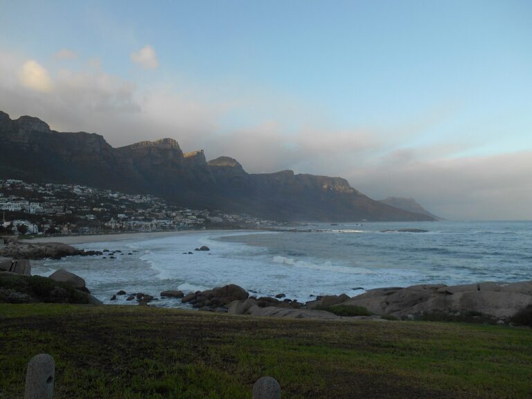 Rocky Atlantic shoreline beneath Cape Town’s coastal mountains