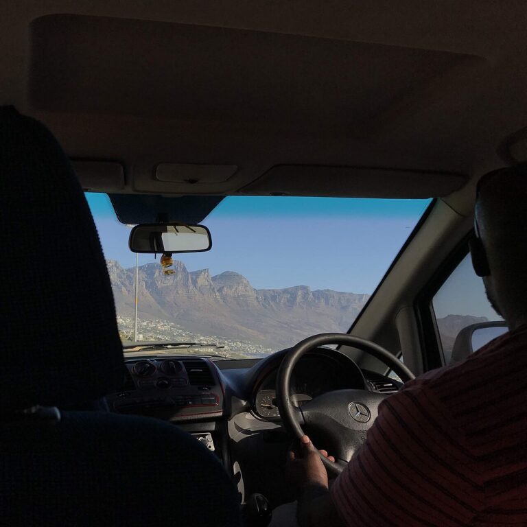 Coastal mountains seen through a vehicle’s windscreen